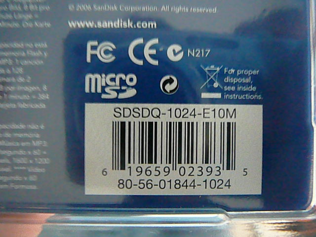 Photo of a SanDisk microSD package showing SDSDQ-1024-E10M, 80-56-01844-1024 and printed UPC digits 619659023935.